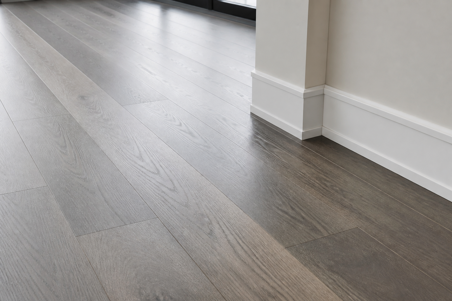 Modern gray hardwood flooring option in Houston, Texas Modern gray hardwood floor sample with matte finish, visible grain, and clean installation seams